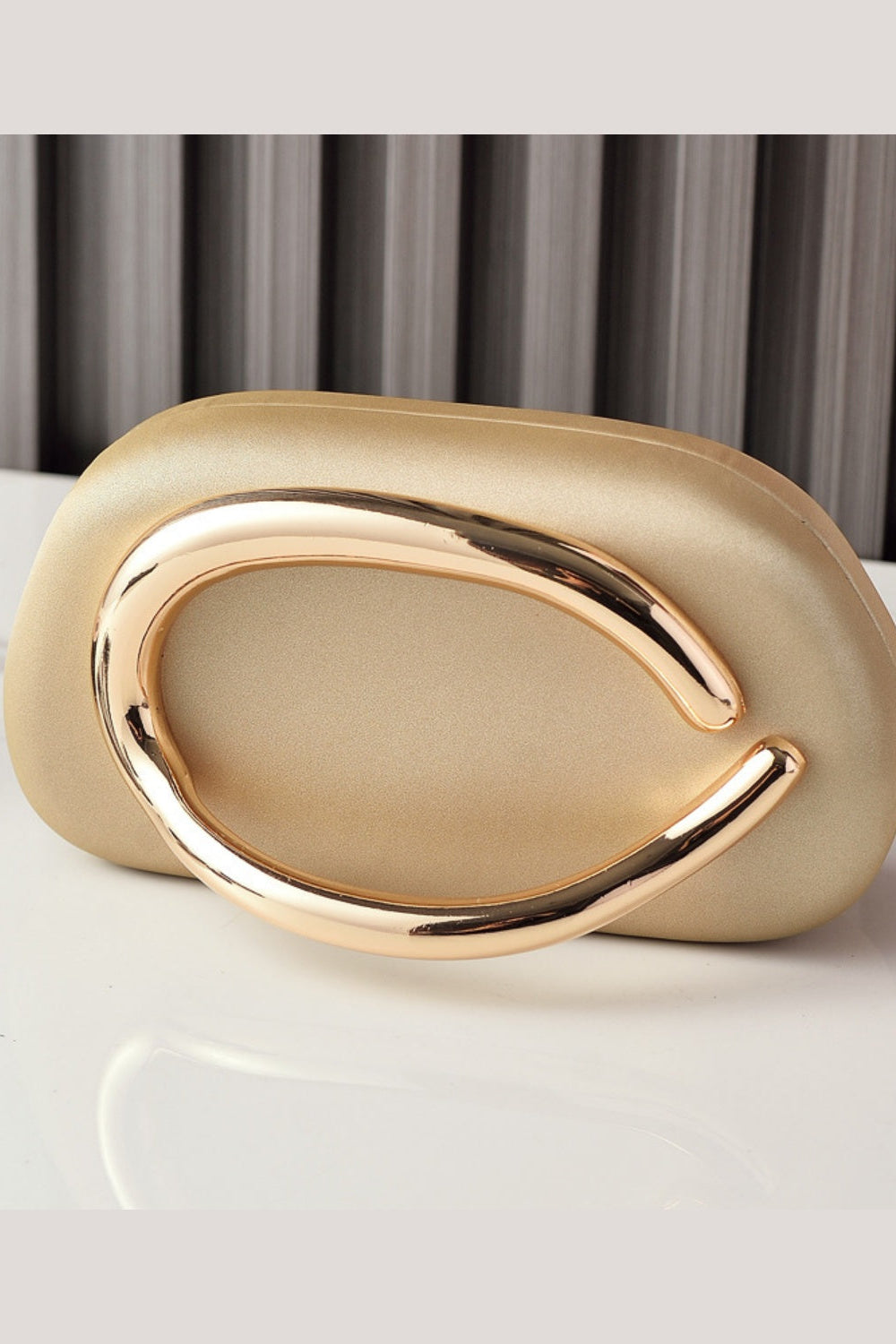 Sleek Structured Clutch Purse Handbag with Gold Sculptural Clasp
