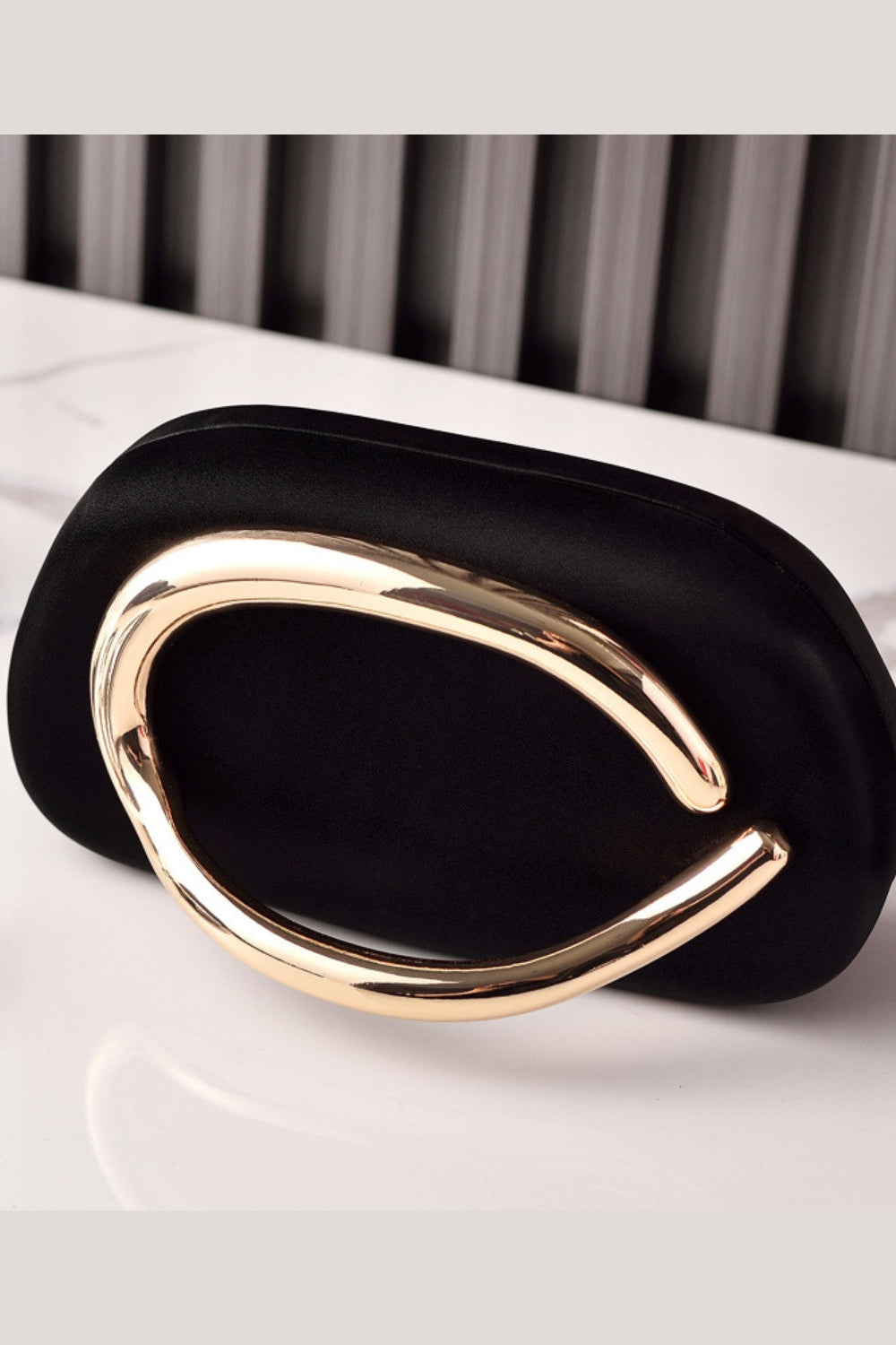 Sleek Structured Clutch Purse Handbag with Gold Sculptural Clasp