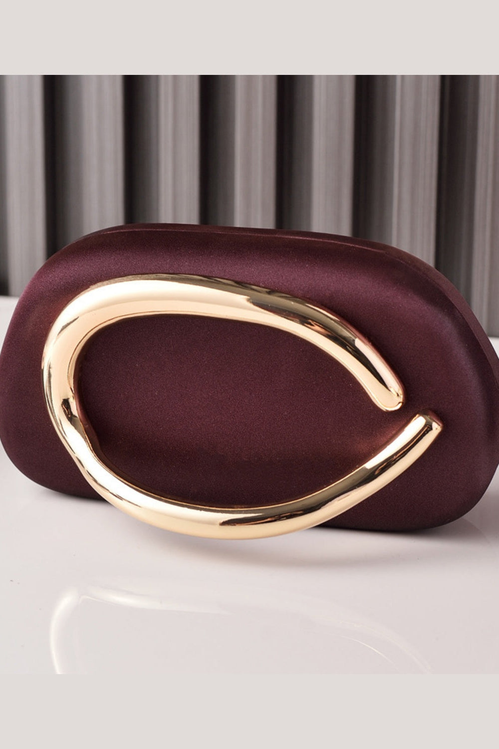 Sleek Structured Clutch Purse Handbag with Gold Sculptural Clasp